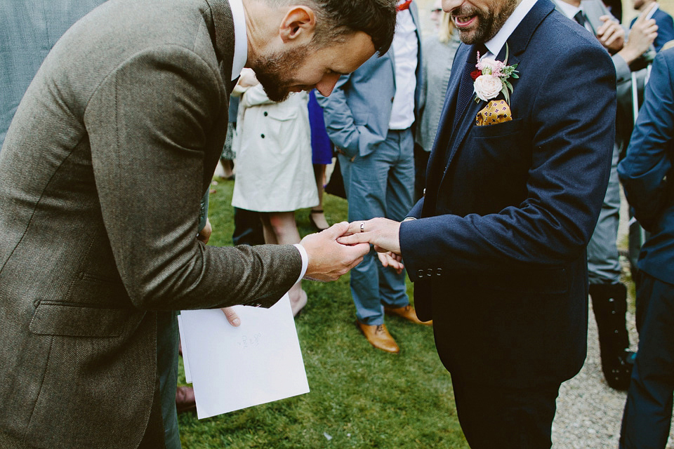 An elegant and quintessentially English village hall wedding in the Cotswolds. Bride Claire wore Ellis Bridals. Photography by David Jenkins.