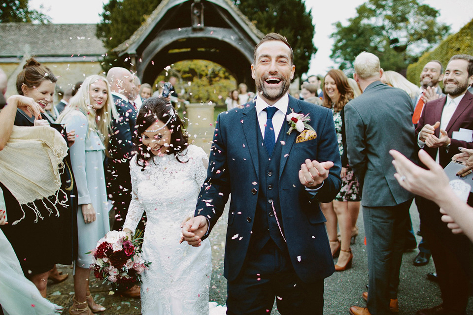 An elegant and quintessentially English village hall wedding in the Cotswolds. Bride Claire wore Ellis Bridals. Photography by David Jenkins.