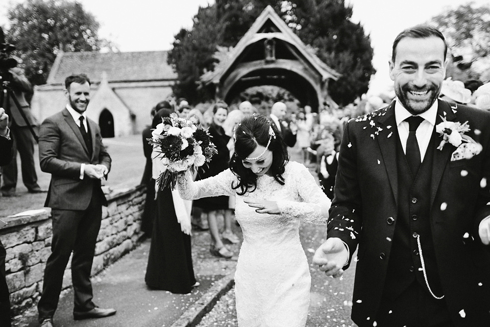 An elegant and quintessentially English village hall wedding in the Cotswolds. Bride Claire wore Ellis Bridals. Photography by David Jenkins.