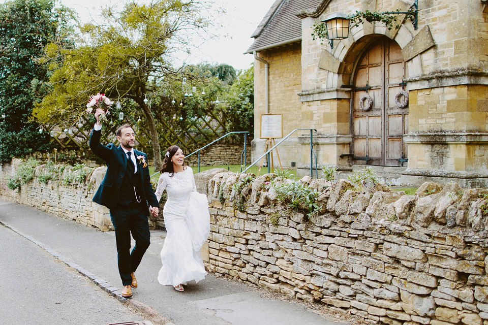 An elegant and quintessentially English village hall wedding in the Cotswolds. Bride Claire wore Ellis Bridals. Photography by David Jenkins.
