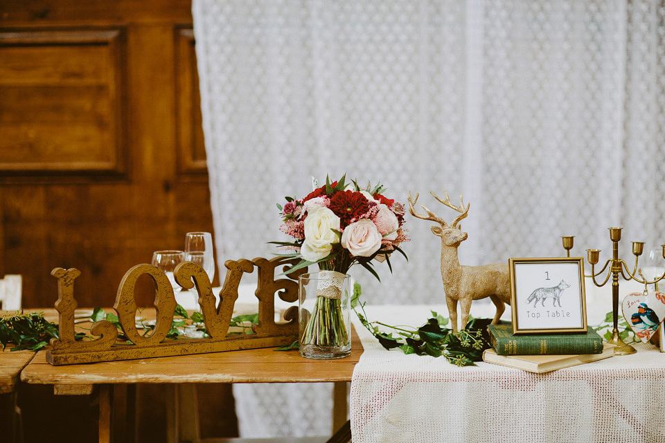 An elegant and quintessentially English village hall wedding in the Cotswolds. Bride Claire wore Ellis Bridals. Photography by David Jenkins.