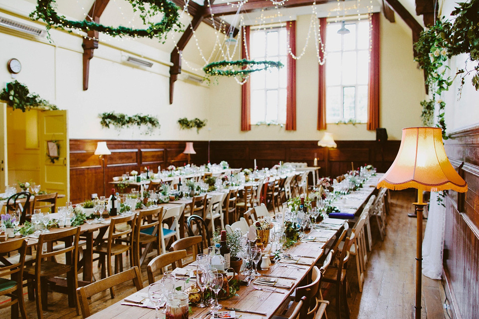 An elegant and quintessentially English village hall wedding in the Cotswolds. Bride Claire wore Ellis Bridals. Photography by David Jenkins.