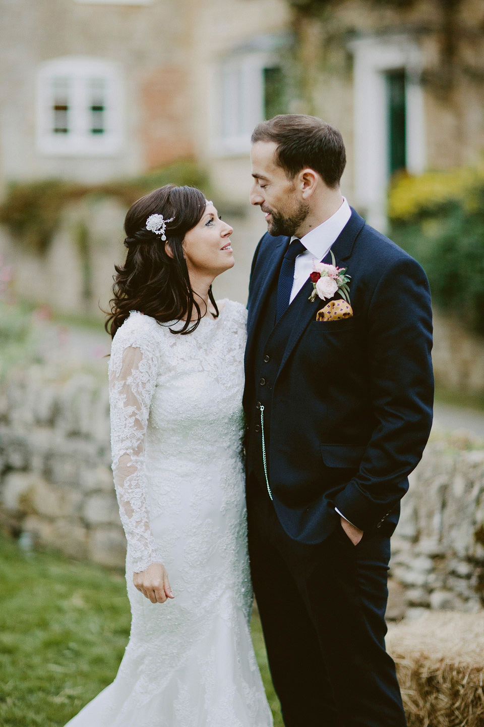 An elegant and quintessentially English village hall wedding in the Cotswolds. Bride Claire wore Ellis Bridals. Photography by David Jenkins.