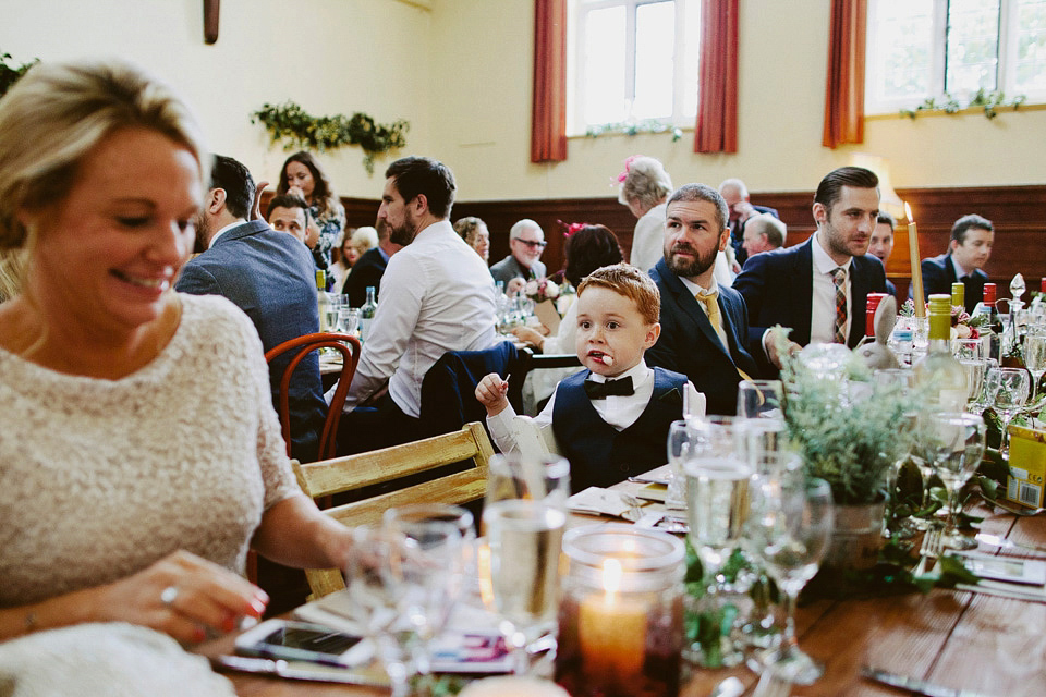 An elegant and quintessentially English village hall wedding in the Cotswolds. Bride Claire wore Ellis Bridals. Photography by David Jenkins.