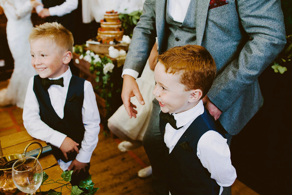 An elegant and quintessentially English village hall wedding in the Cotswolds. Bride Claire wore Ellis Bridals. Photography by David Jenkins.