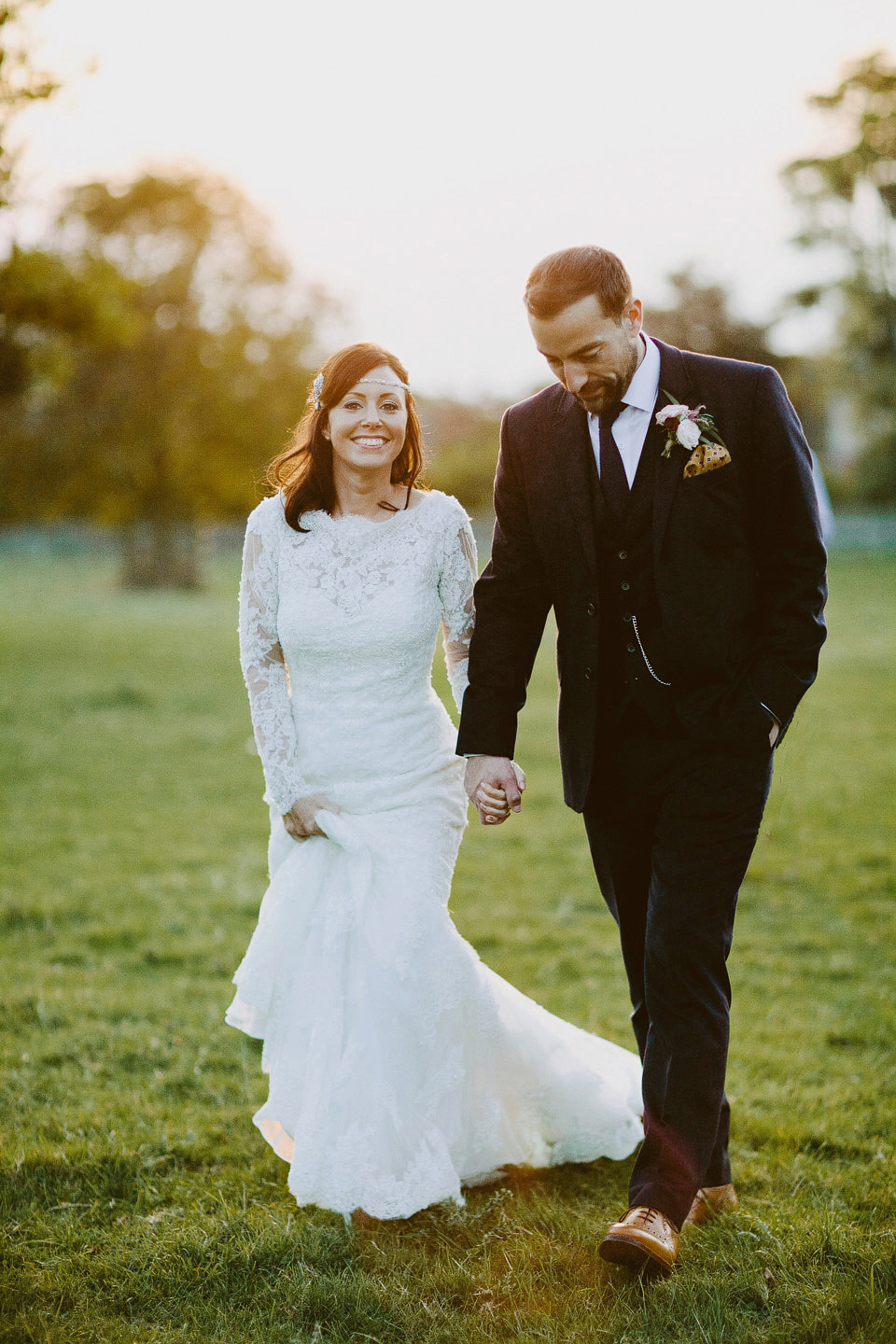 An elegant and quintessentially English village hall wedding in the Cotswolds. Bride Claire wore Ellis Bridals. Photography by David Jenkins.