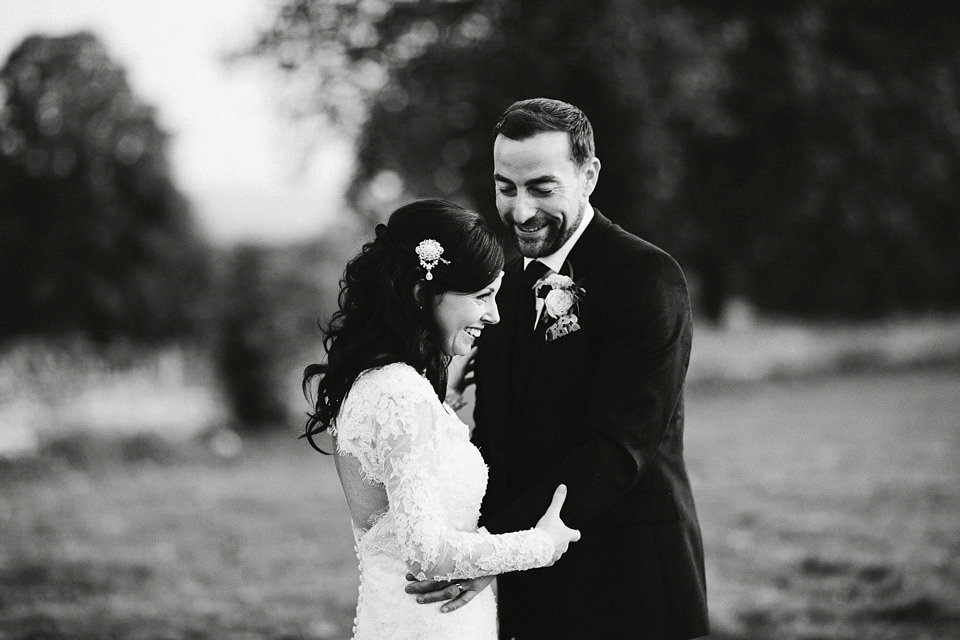 An elegant and quintessentially English village hall wedding in the Cotswolds. Bride Claire wore Ellis Bridals. Photography by David Jenkins.