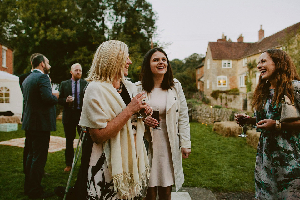 An elegant and quintessentially English village hall wedding in the Cotswolds. Bride Claire wore Ellis Bridals. Photography by David Jenkins.