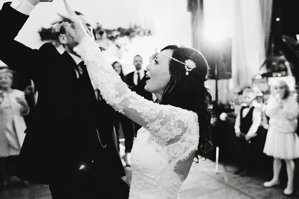 An elegant and quintessentially English village hall wedding in the Cotswolds. Bride Claire wore Ellis Bridals. Photography by David Jenkins.