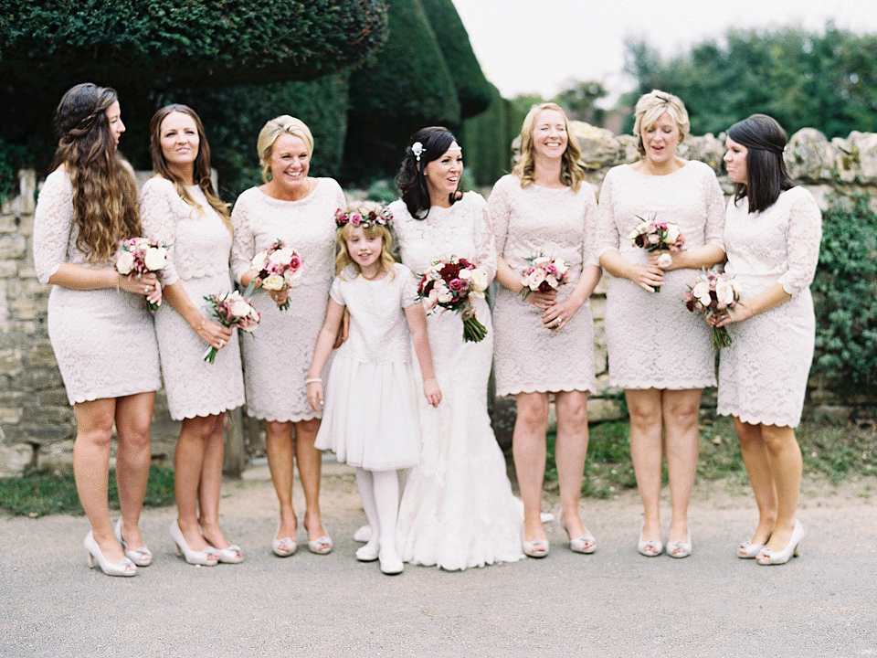 An elegant and quintessentially English village hall wedding in the Cotswolds. Bride Claire wore Ellis Bridals. Photography by David Jenkins.