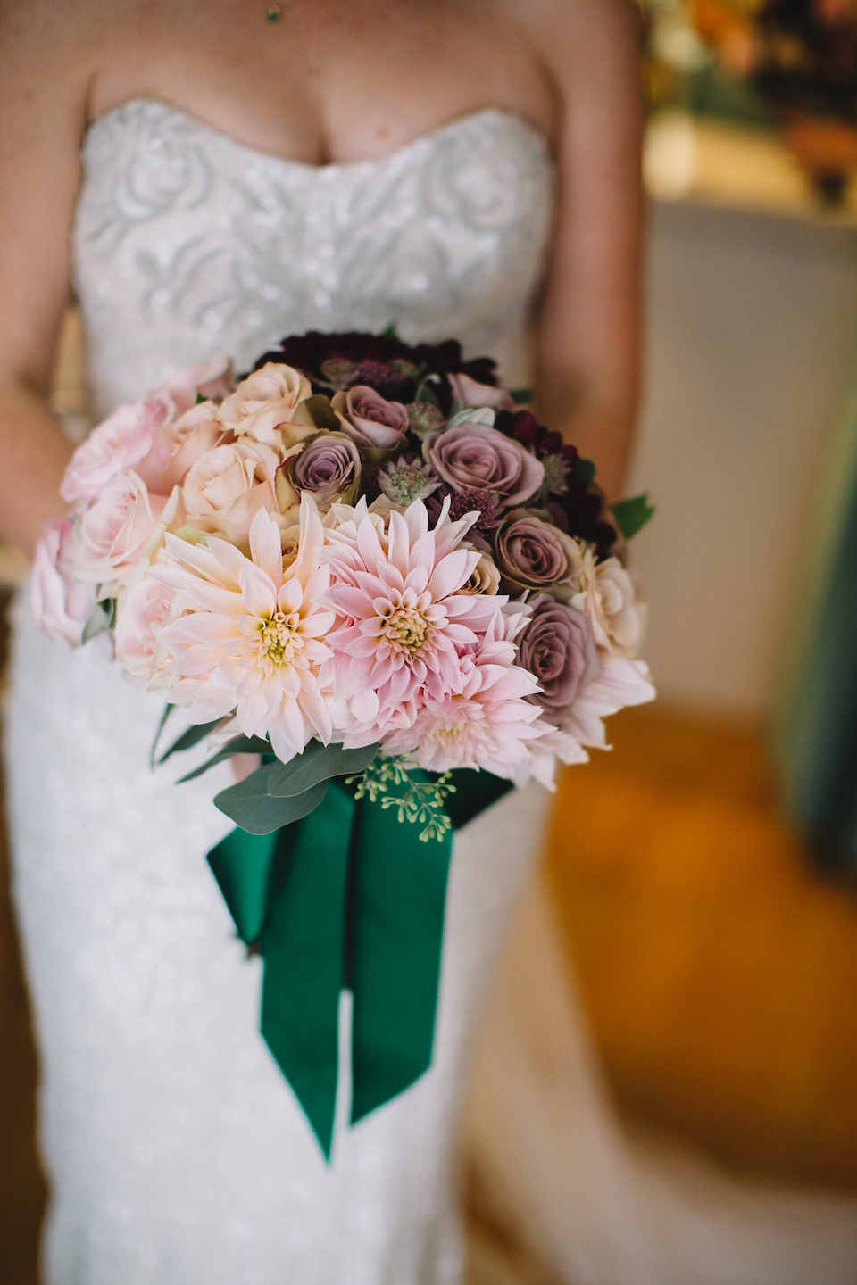 The bride wore a Karen Willis Holmes gown for her London wedding in shades of green. Photography by Alex Wysocki.