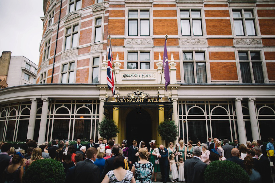 The bride wore a Karen Willis Holmes gown for her London wedding in shades of green. Photography by Alex Wysocki.