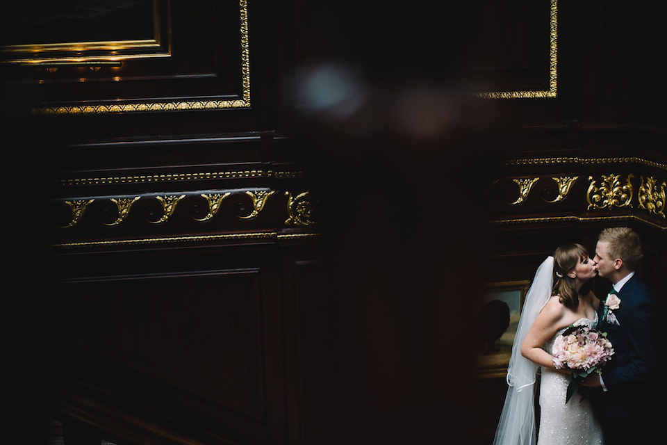 The bride wore a Karen Willis Holmes gown for her London wedding in shades of green. Photography by Alex Wysocki.