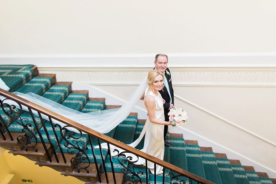 Bride Nicky wore an Amnada Wakeley gown for her pastel coloured, Spring time wedding at Botleys Mansion. Photography by Helen Cawte.