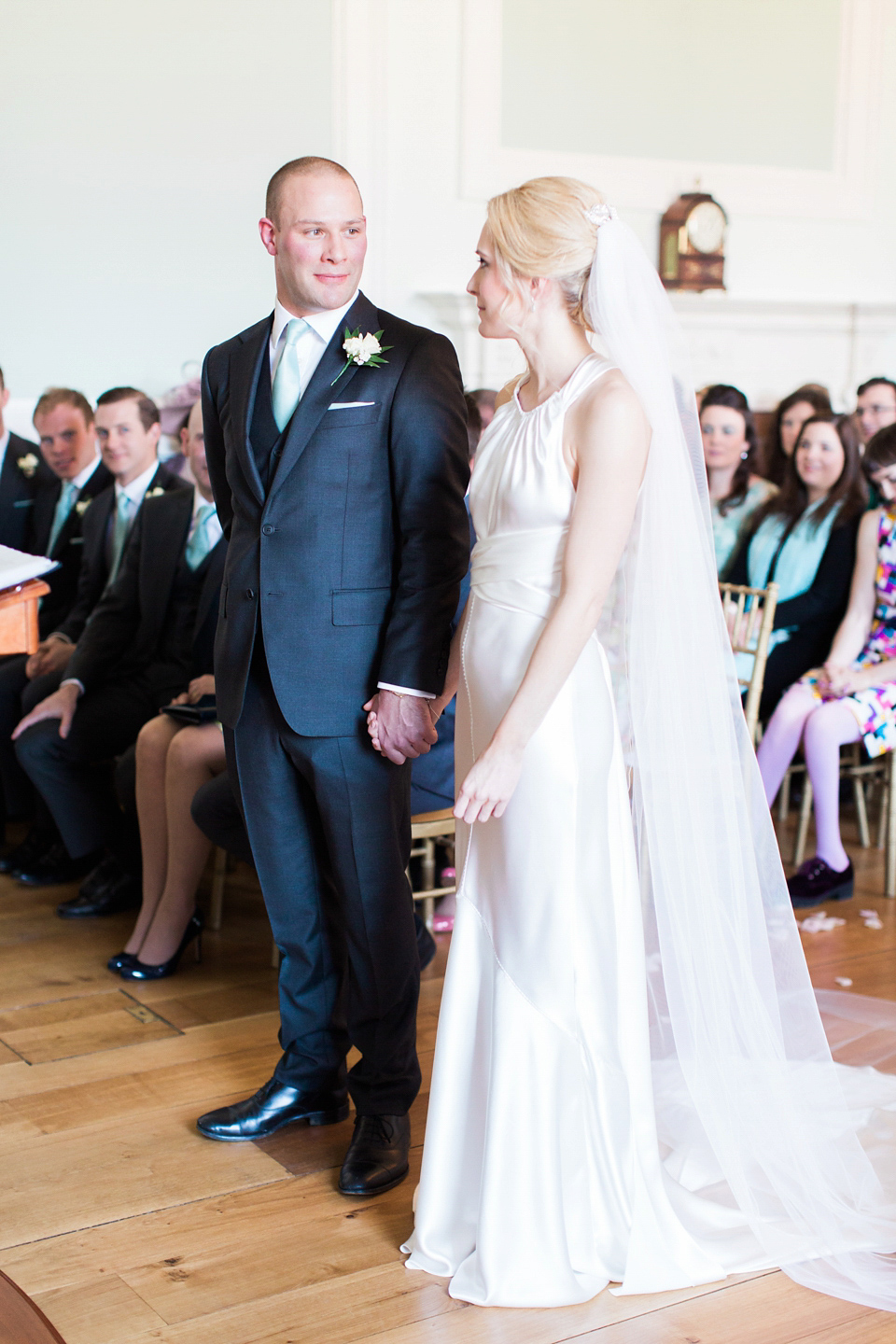 Bride Nicky wore an Amnada Wakeley gown for her pastel coloured, Spring time wedding at Botleys Mansion. Photography by Helen Cawte.