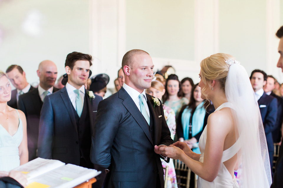 Bride Nicky wore an Amnada Wakeley gown for her pastel coloured, Spring time wedding at Botleys Mansion. Photography by Helen Cawte.