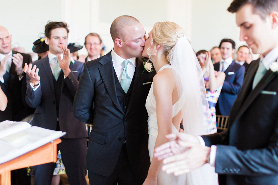 Bride Nicky wore an Amnada Wakeley gown for her pastel coloured, Spring time wedding at Botleys Mansion. Photography by Helen Cawte.