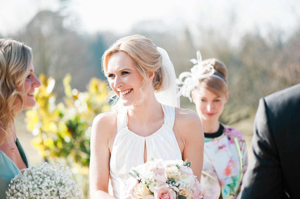 Bride Nicky wore an Amnada Wakeley gown for her pastel coloured, Spring time wedding at Botleys Mansion. Photography by Helen Cawte.