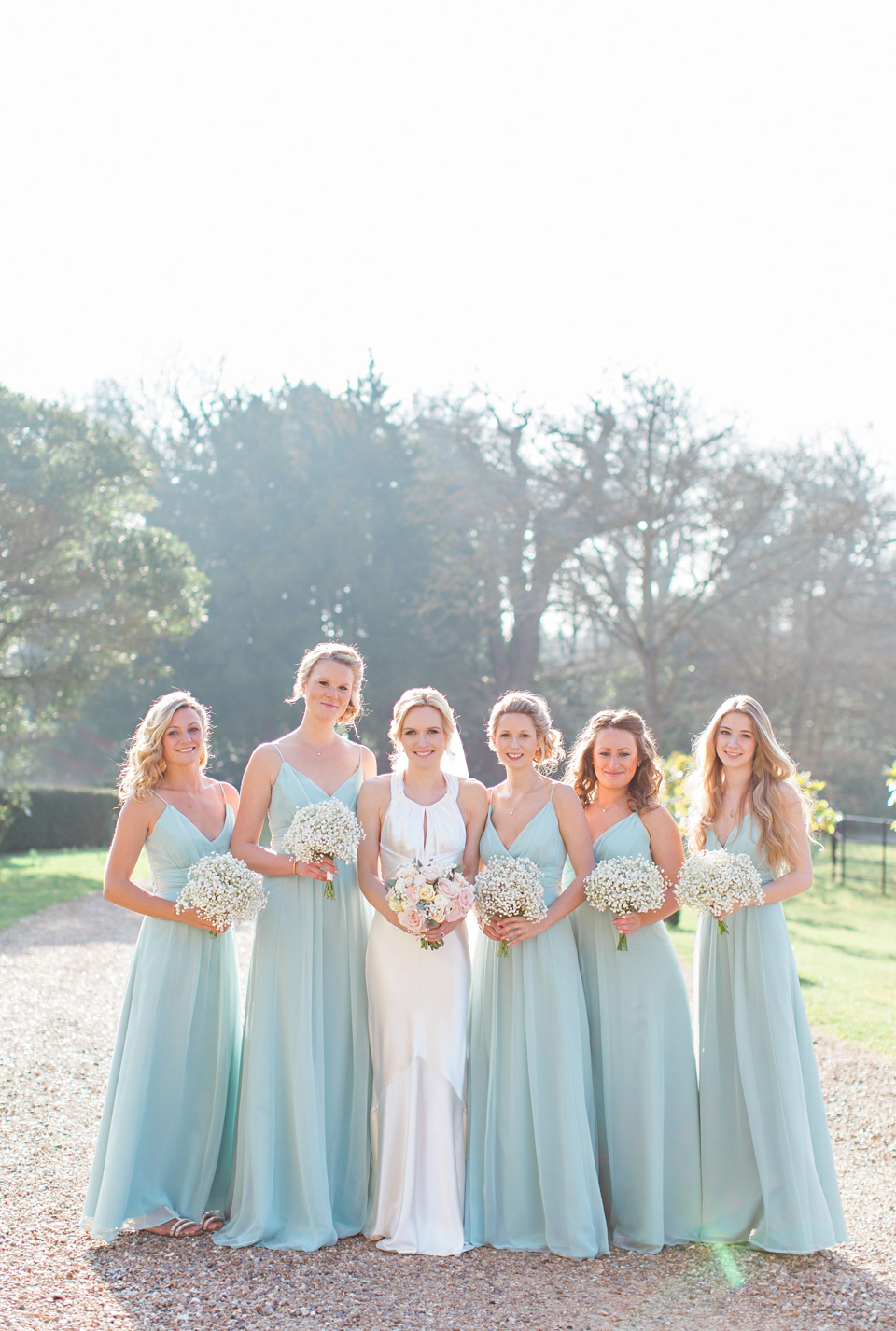 Bride Nicky wore an Amnada Wakeley gown for her pastel coloured, Spring time wedding at Botleys Mansion. Photography by Helen Cawte.