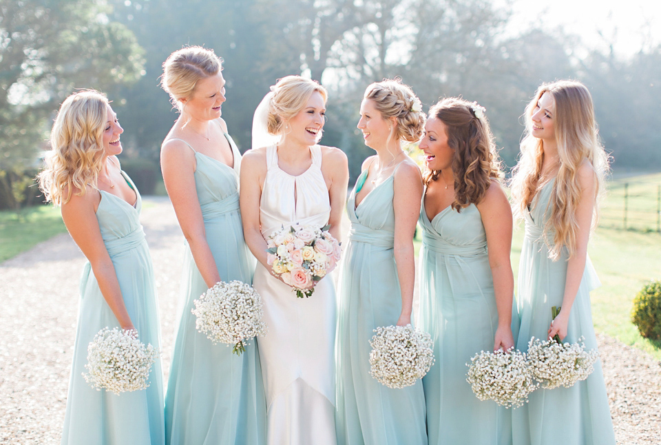 Bride Nicky wore an Amnada Wakeley gown for her pastel coloured, Spring time wedding at Botleys Mansion. Photography by Helen Cawte.