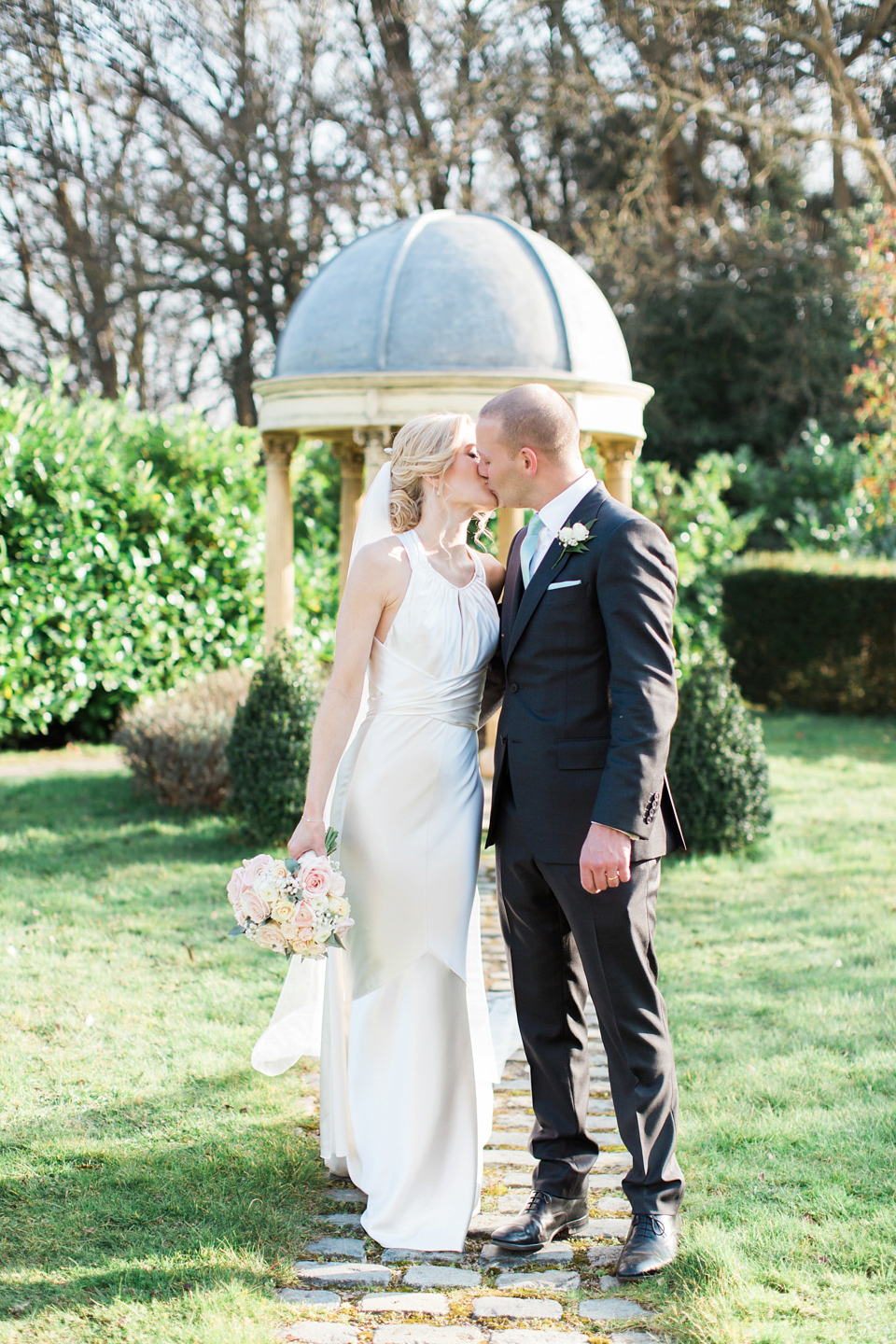 Bride Nicky wore an Amnada Wakeley gown for her pastel coloured, Spring time wedding at Botleys Mansion. Photography by Helen Cawte.