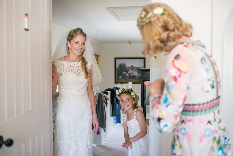 Bride Lou Lou wears a Mori Lee gown for her Sherborne Abbey wedding and garden party reception. Photography by Louise Adby.