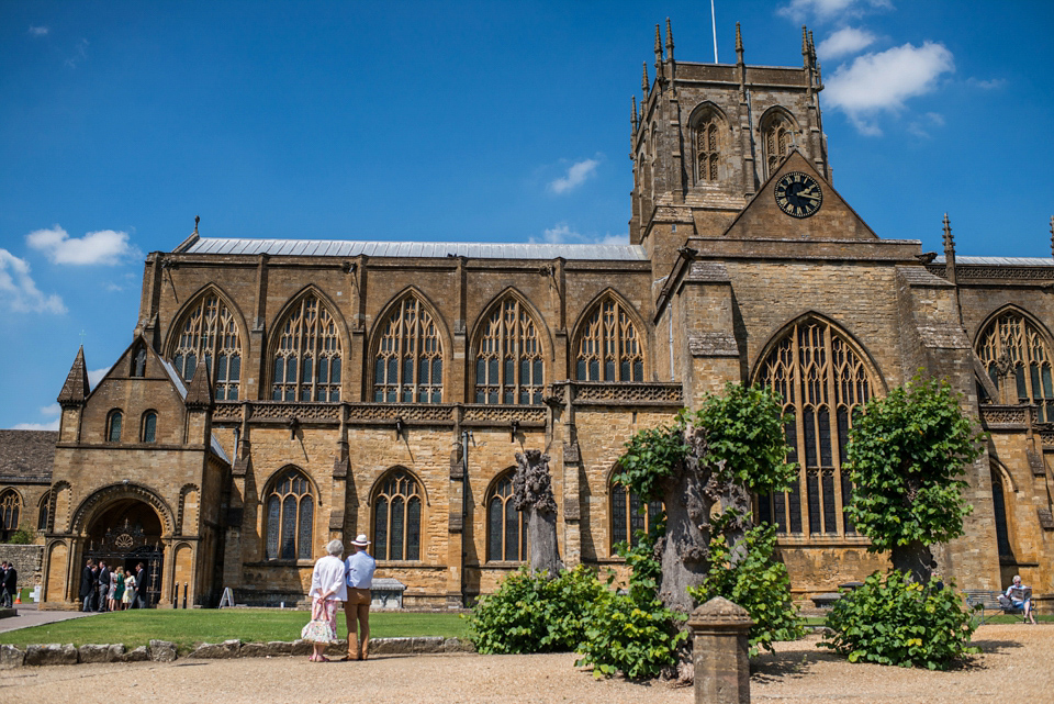 Bride Lou Lou wears a Mori Lee gown for her Sherborne Abbey wedding and garden party reception. Photography by Louise Adby.