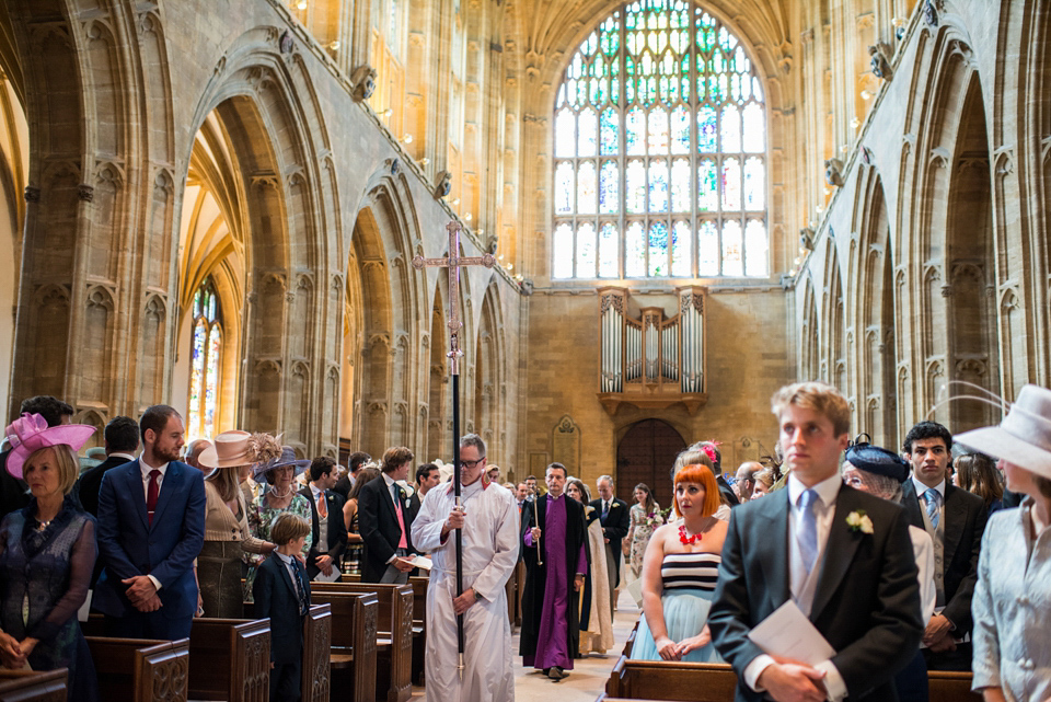 Bride Lou Lou wears a Mori Lee gown for her Sherborne Abbey wedding and garden party reception. Photography by Louise Adby.