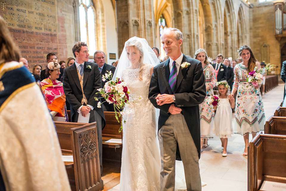 Bride Lou Lou wears a Mori Lee gown for her Sherborne Abbey wedding and garden party reception. Photography by Louise Adby.