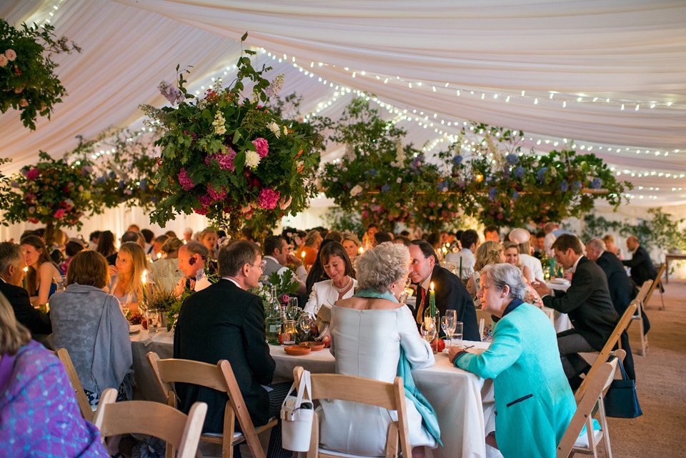 Bride Lou Lou wears a Mori Lee gown for her Sherborne Abbey wedding and garden party reception. Photography by Louise Adby.