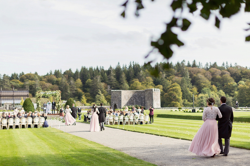 Juliana of Good Juju Ink wears a Marchesa gown for her super tasteful and elegant fairy tale Celtic and Jewish fusion wedding at Ashford Castle. Photography by Craig & Eva Sanders.