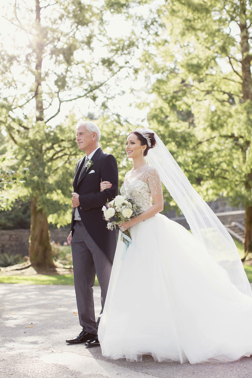 Juliana of Good Juju Ink wears a Marchesa gown for her super tasteful and elegant fairy tale Celtic and Jewish fusion wedding at Ashford Castle. Photography by Craig & Eva Sanders.