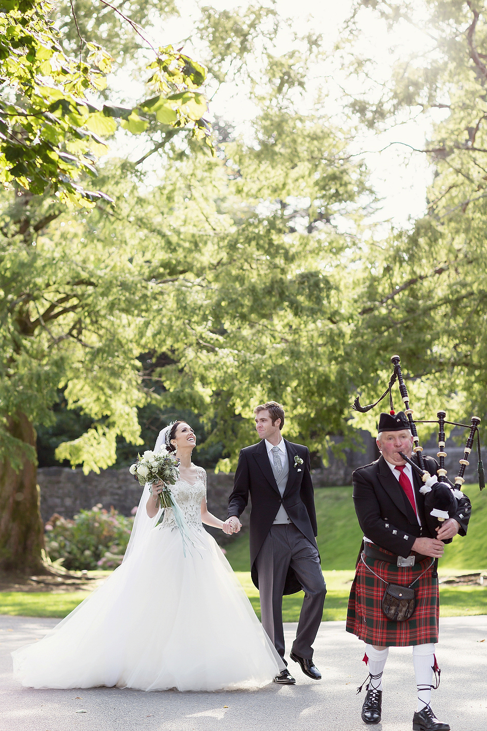 Juliana of Good Juju Ink wears a Marchesa gown for her super tasteful and elegant fairy tale Celtic and Jewish fusion wedding at Ashford Castle. Photography by Craig & Eva Sanders.