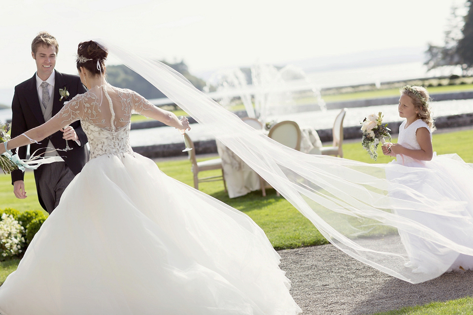 Juliana of Good Juju Ink wears a Marchesa gown for her super tasteful and elegant fairy tale Celtic and Jewish fusion wedding at Ashford Castle. Photography by Craig & Eva Sanders.