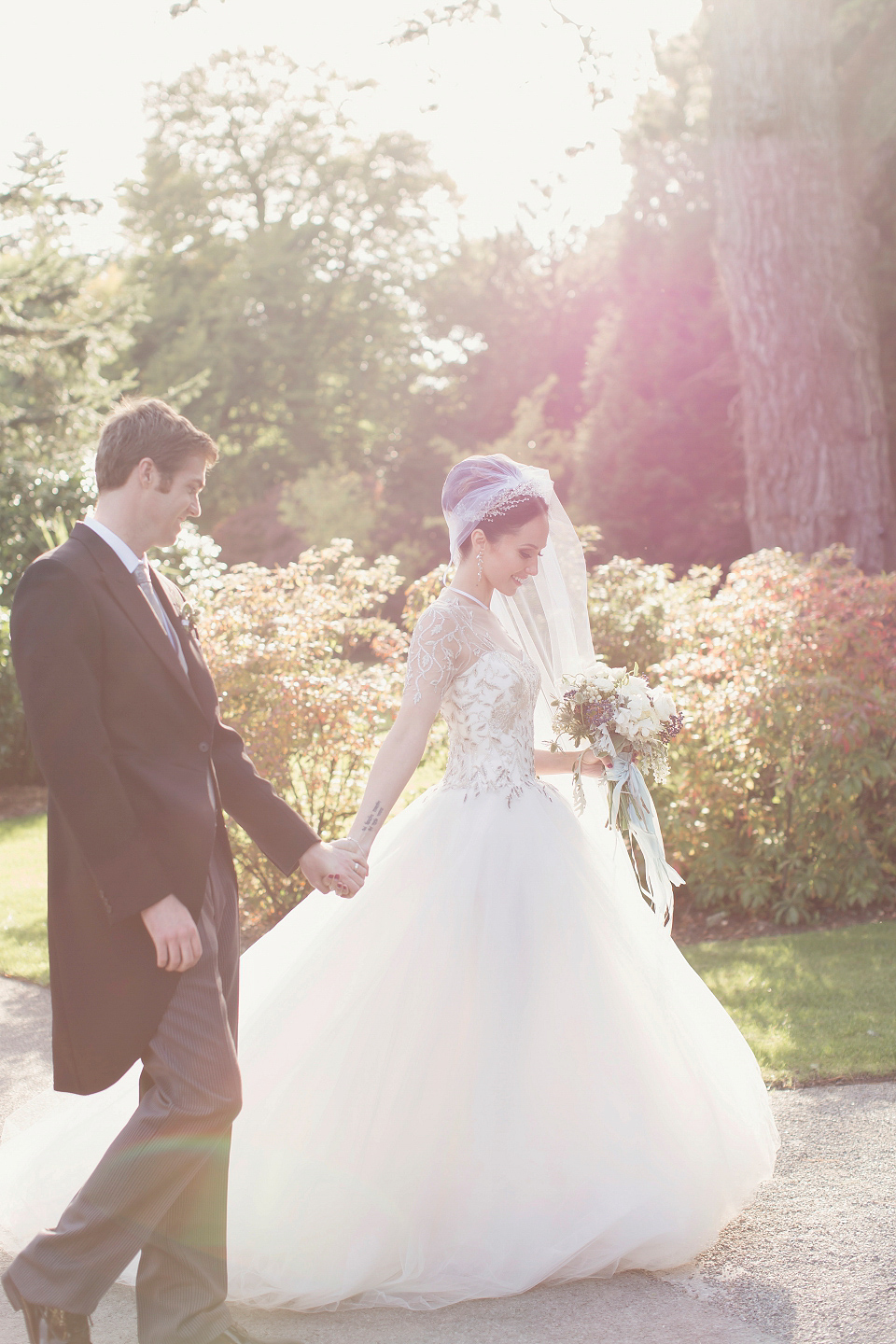 Juliana of Good Juju Ink wears a Marchesa gown for her super tasteful and elegant fairy tale Celtic and Jewish fusion wedding at Ashford Castle. Photography by Craig & Eva Sanders.