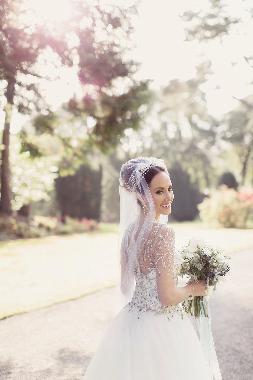 Juliana of Good Juju Ink wears a Marchesa gown for her super tasteful and elegant fairy tale Celtic and Jewish fusion wedding at Ashford Castle. Photography by Craig & Eva Sanders.