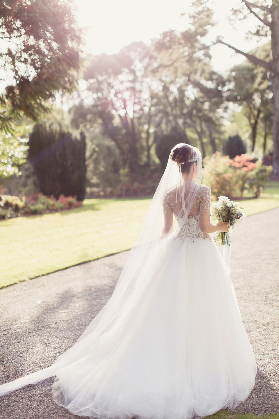 Juliana of Good Juju Ink wears a Marchesa gown for her super tasteful and elegant fairy tale Celtic and Jewish fusion wedding at Ashford Castle. Photography by Craig & Eva Sanders.