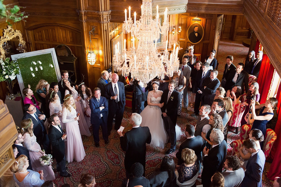 Juliana of Good Juju Ink wears a Marchesa gown for her super tasteful and elegant fairy tale Celtic and Jewish fusion wedding at Ashford Castle. Photography by Craig & Eva Sanders.