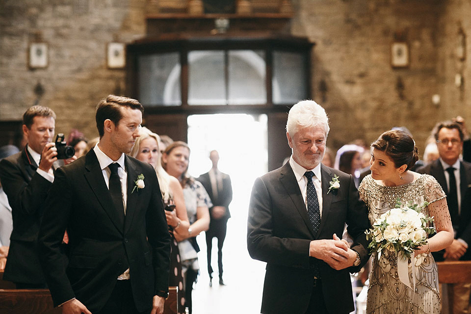 Amelia wore a beaded gown by Eliza Jane Howell for her September wedding in Tuscany. Photograph by Matteo Crescentini, styling and wedding planning by The Knot Italy.