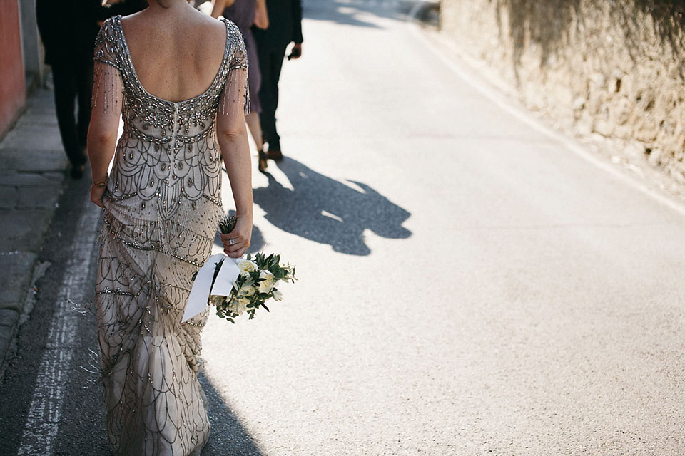 Amelia wore a beaded gown by Eliza Jane Howell for her September wedding in Tuscany. Photograph by Matteo Crescentini, styling and wedding planning by The Knot Italy.