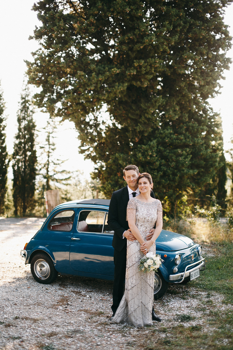 Amelia wore a beaded gown by Eliza Jane Howell for her September wedding in Tuscany. Photograph by Matteo Crescentini, styling and wedding planning by The Knot Italy.