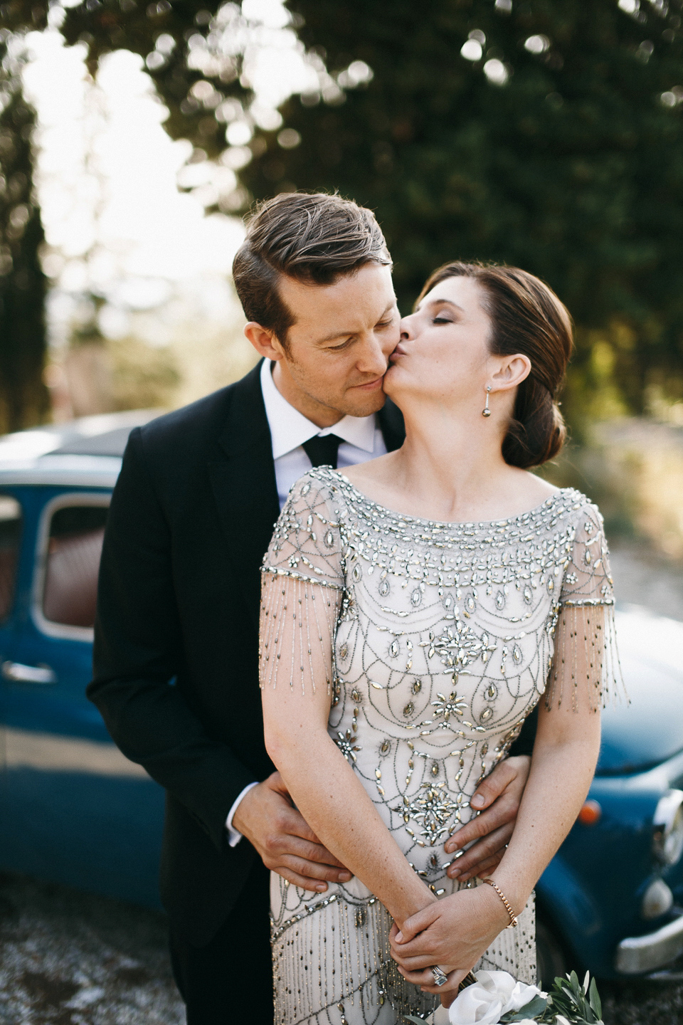 Amelia wore a beaded gown by Eliza Jane Howell for her September wedding in Tuscany. Photograph by Matteo Crescentini, styling and wedding planning by The Knot Italy.