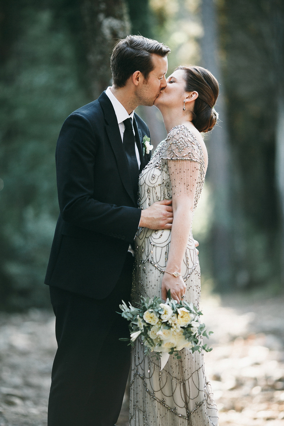 Amelia wore a beaded gown by Eliza Jane Howell for her September wedding in Tuscany. Photograph by Matteo Crescentini, styling and wedding planning by The Knot Italy.