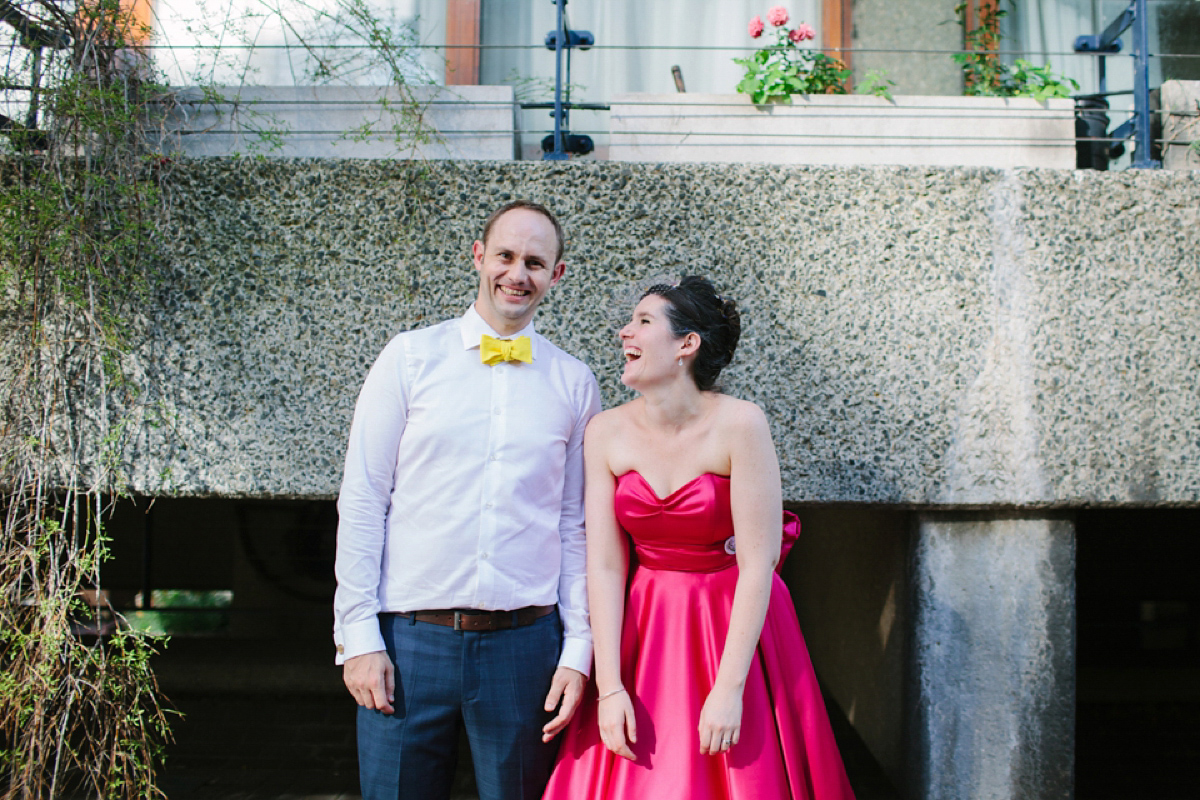 A pink Candy Anthony dress for a colourful and modern wedding at The Barbican. Photography by Joanna Brown.