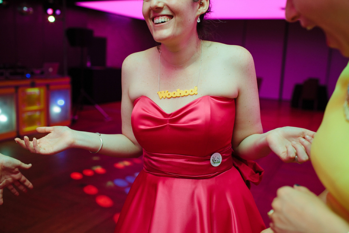 A pink Candy Anthony dress for a colourful and modern wedding at The Barbican. Photography by Joanna Brown.