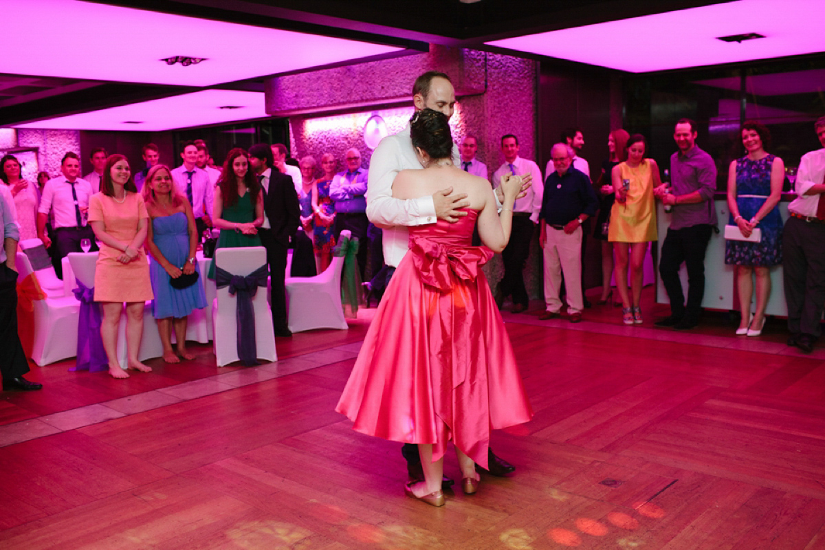 A pink Candy Anthony dress for a colourful and modern wedding at The Barbican. Photography by Joanna Brown.