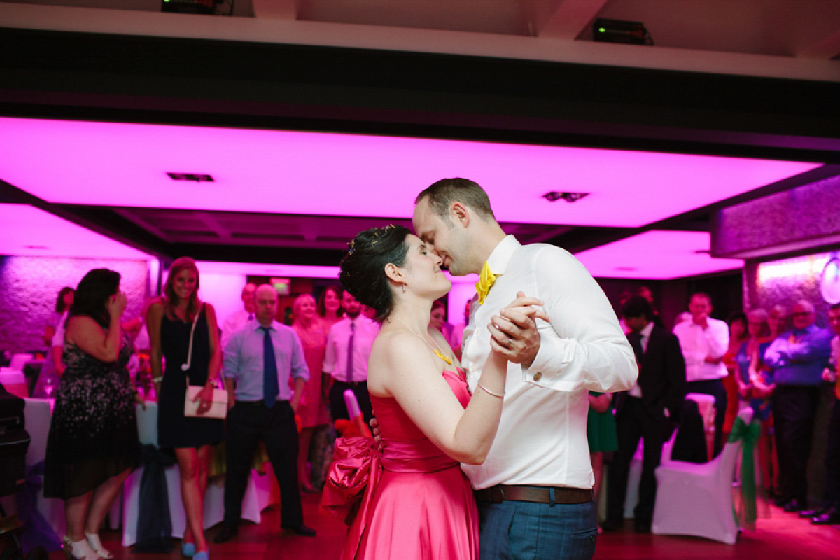 A pink Candy Anthony dress for a colourful and modern wedding at The Barbican. Photography by Joanna Brown.