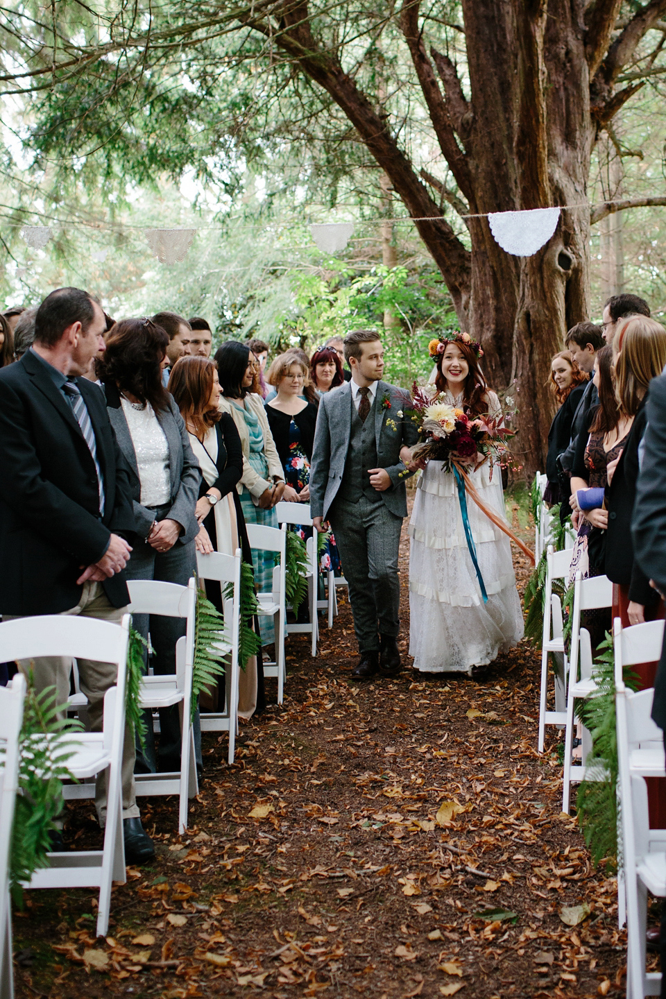 A Humanist woodland wedding for an ethereal, flame haired 1940's inspired bride. Photography by Caro Weiss, film by Sugar8.