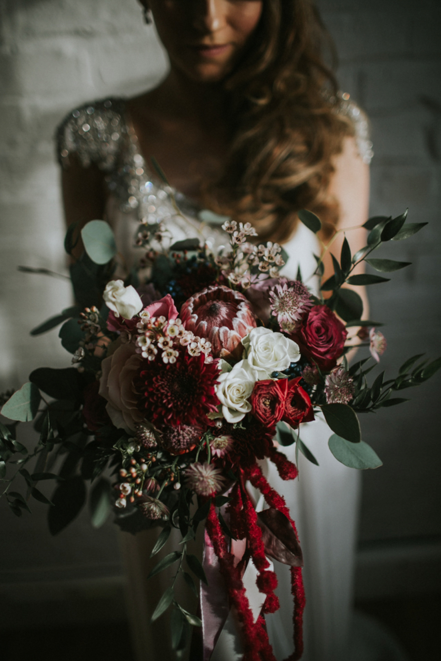 Alicia wore an Anna Campbell gown for her 1920's inspired rustic winter wedding. Photography by DSB Creative.