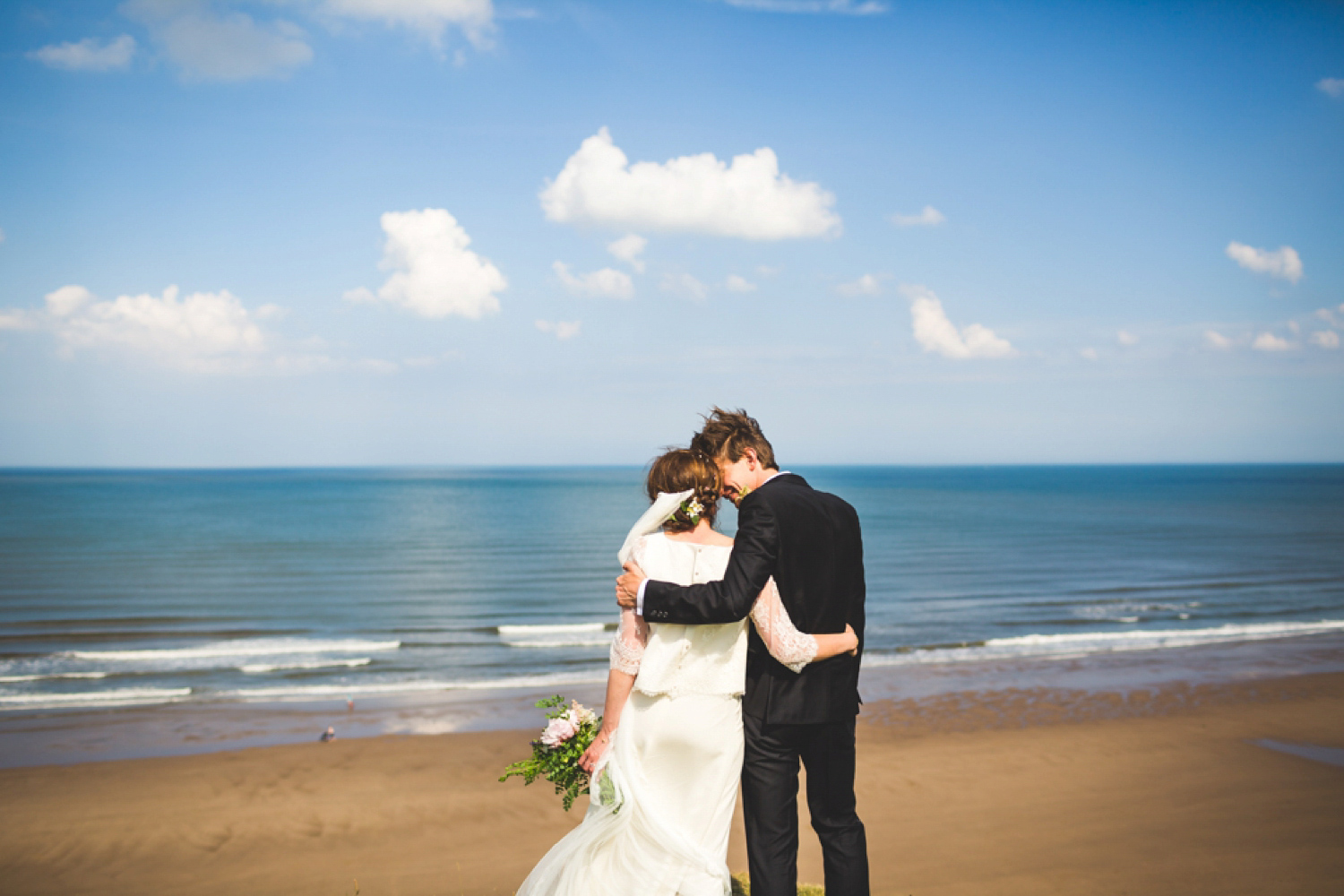 Bride Kate wore a Laure de Sagazan skirt and Elise Hameau top, both from The Mews Bridal of Notting Hill for her wedding in Filey North Yorkshire. Images by Photography34.